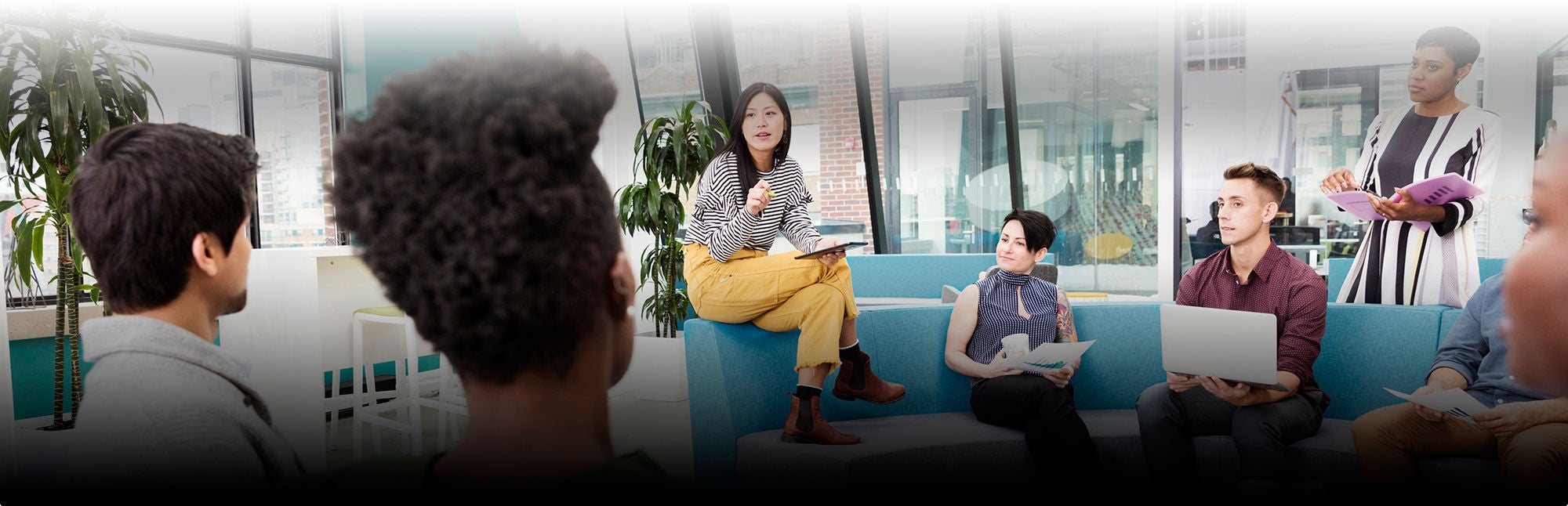 Group of people talking on couch