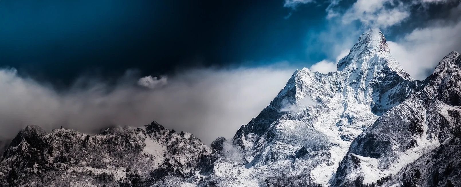 Mountain peak with rich blue skies above